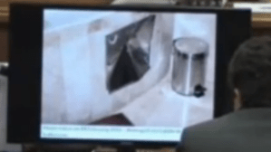 damaged metal plate on side of bath tub