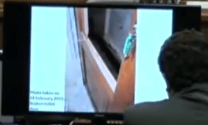 outside of toilet door with green key