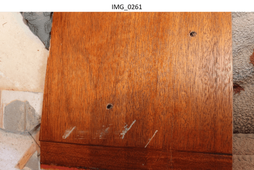 Marks on wood panel in bathroom