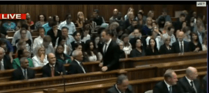 Oscar walking to stand